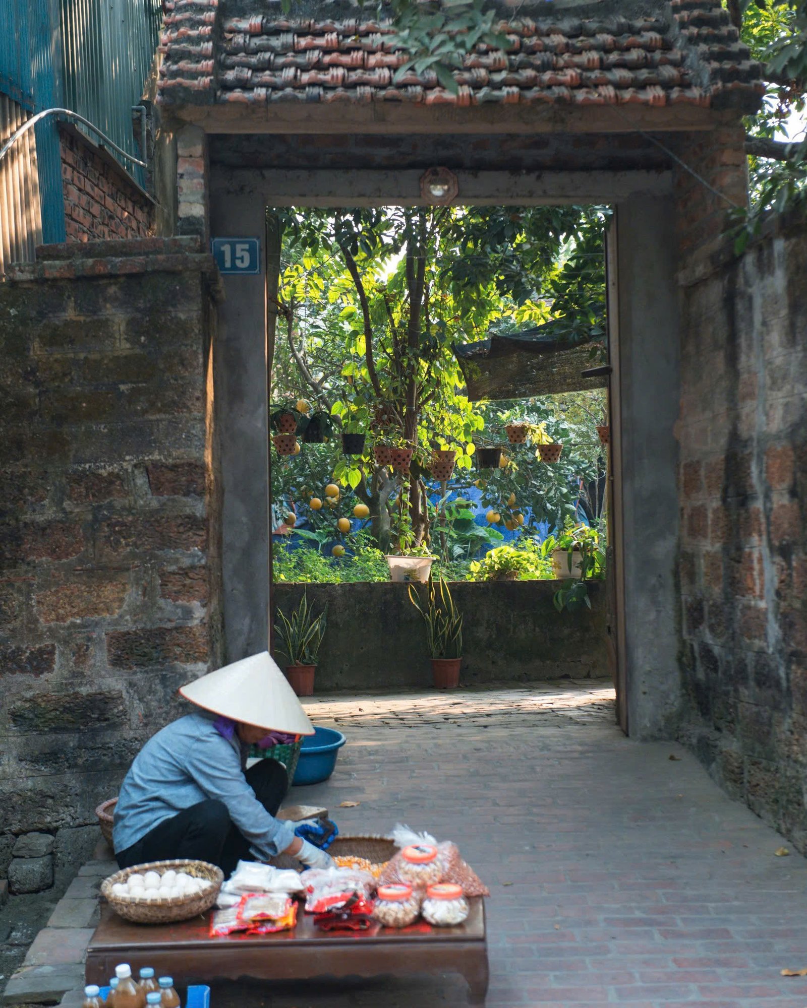 Old gate and street vendor in Hue