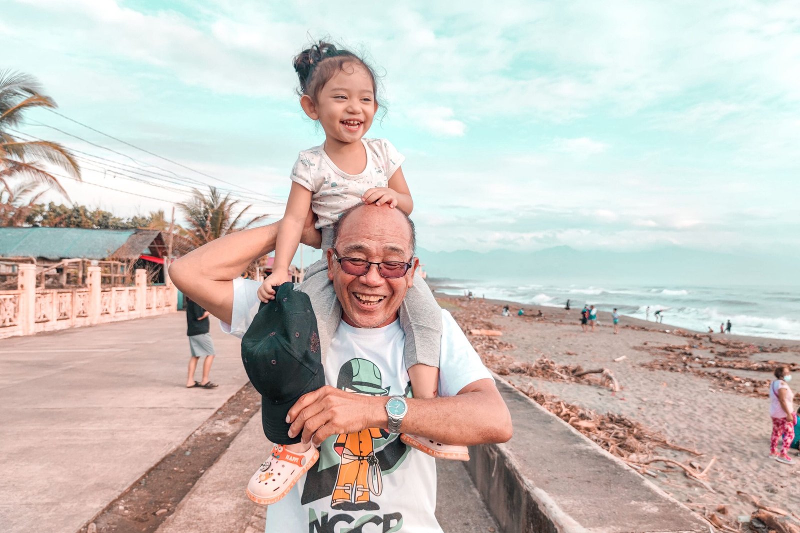 A family running together on the beach in Da Nang